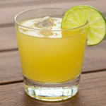 Sugar free margarita mocktail with salted rim and lime garnish