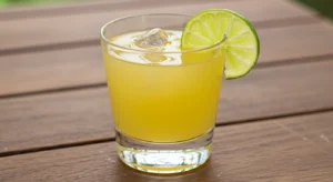 Sugar free margarita mocktail with salted rim and lime garnish